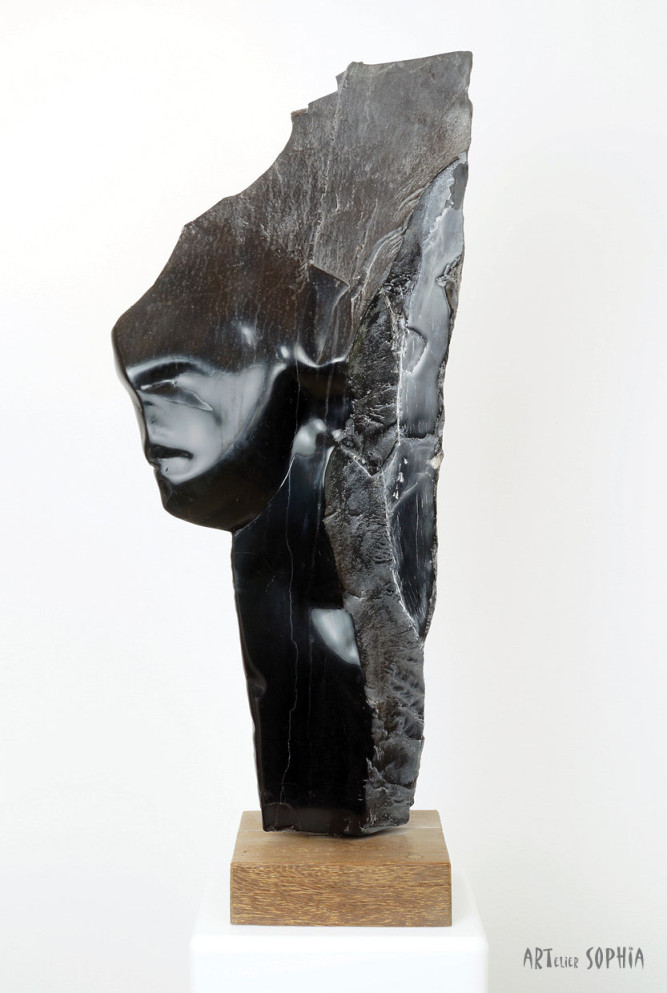 Stone sculpture woman face